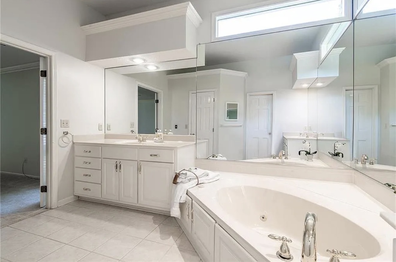Original vanity and tub layout before the remodel