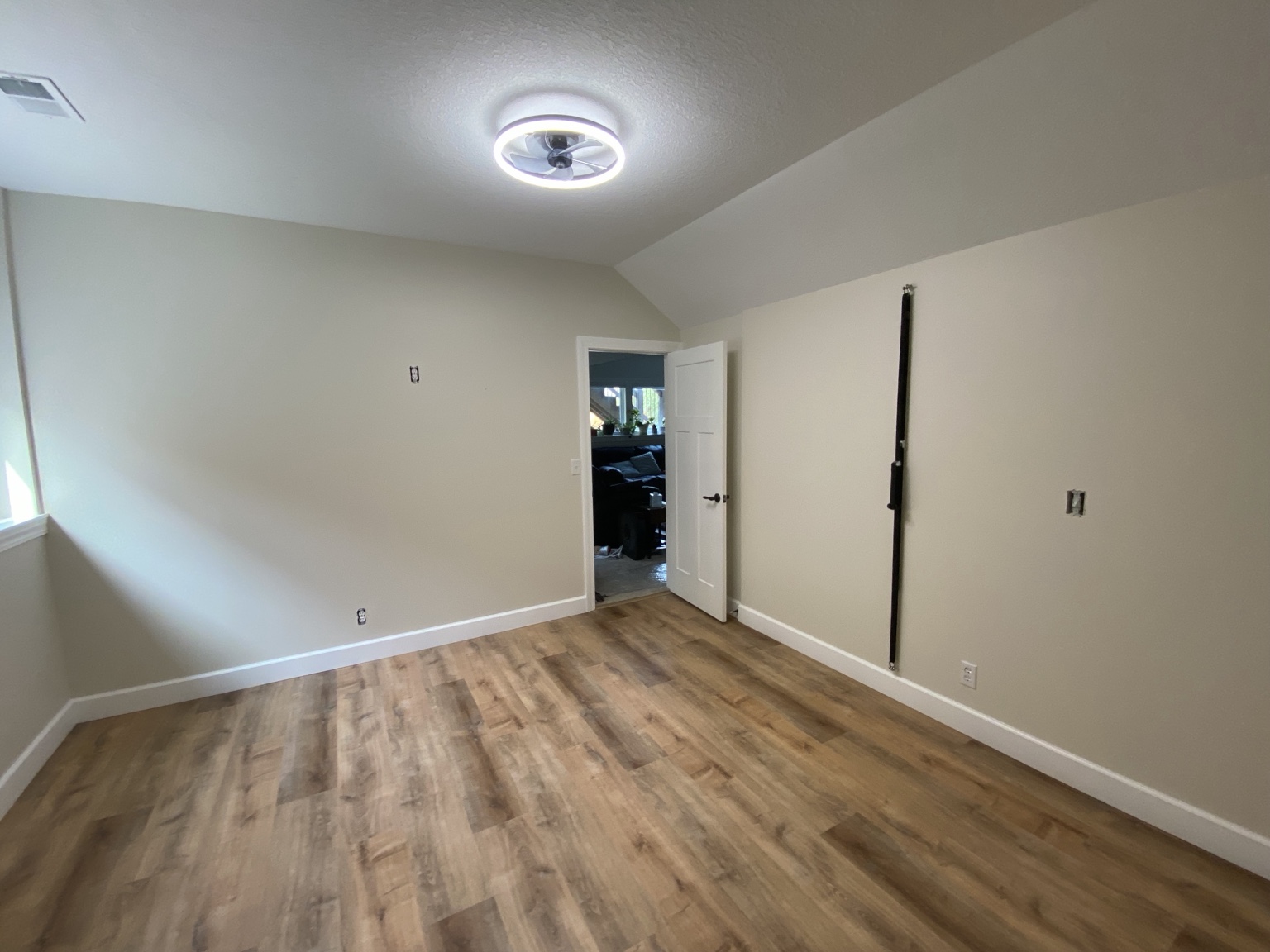 Reverse view of the completed room toward the doorway to the adjoining lower-level space