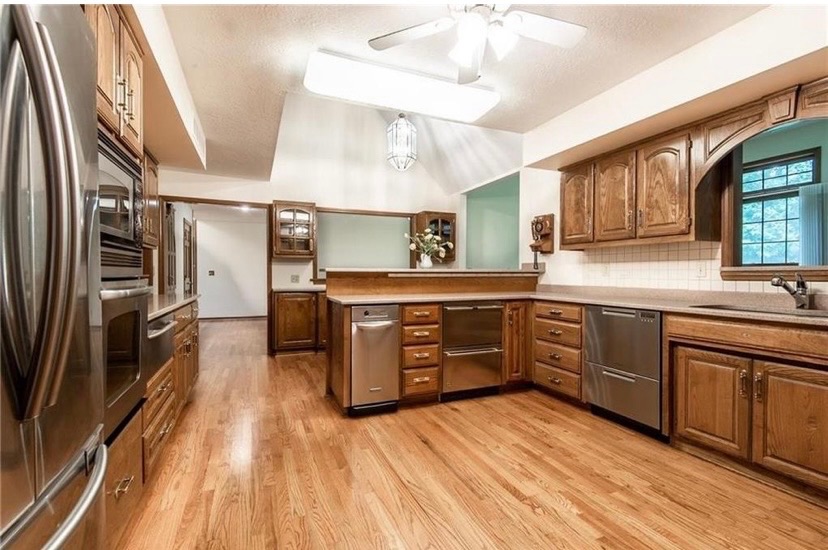 Kitchen before the remodel, closed off from the surrounding living areas