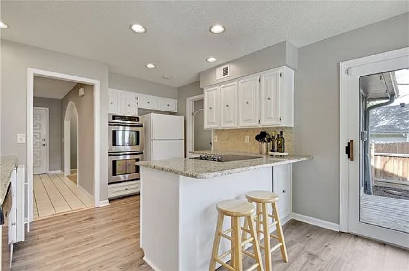 Angled view of the original kitchen before the remodel