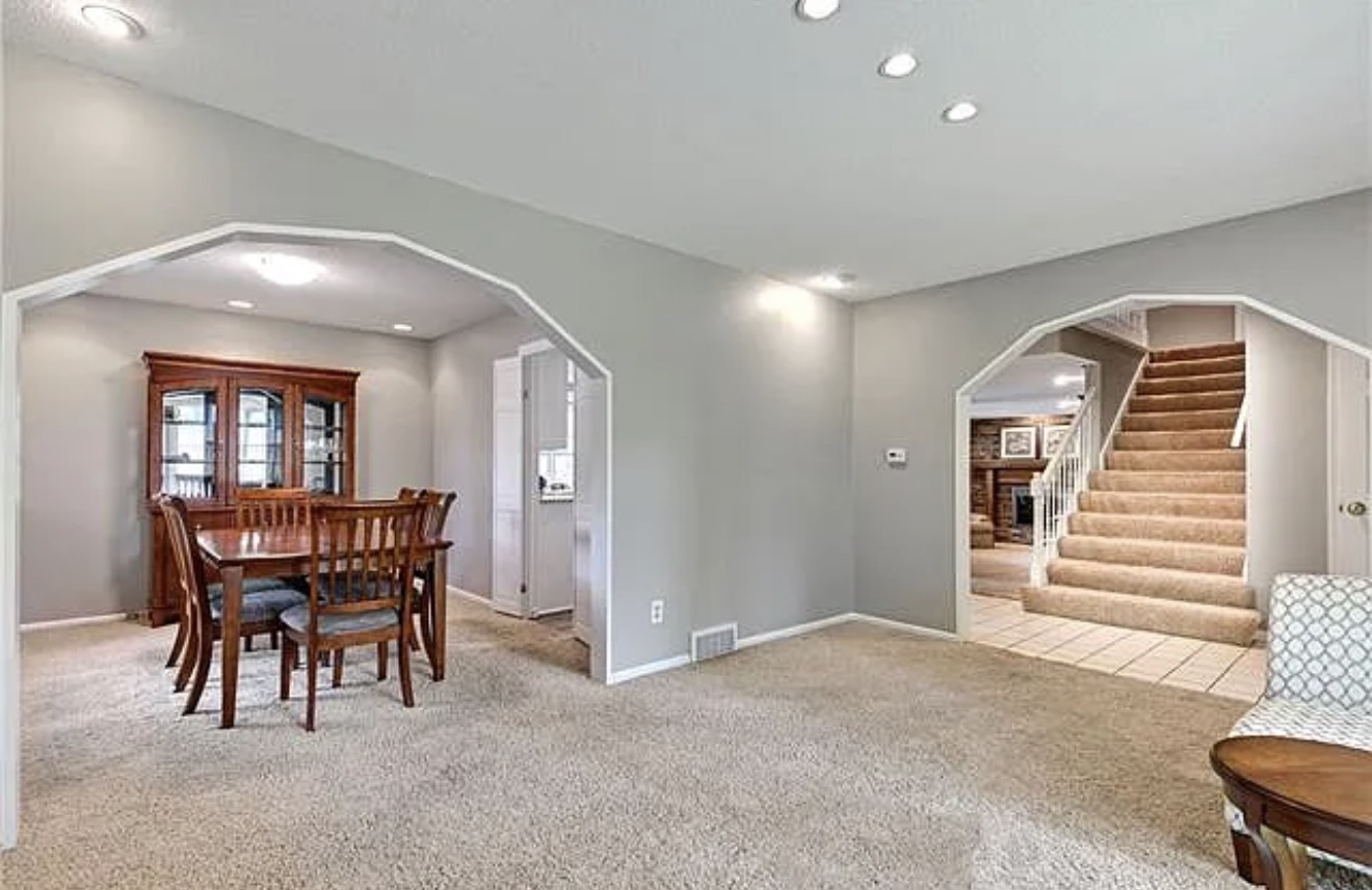 The existing angled openings between the main-floor rooms before they were squared off